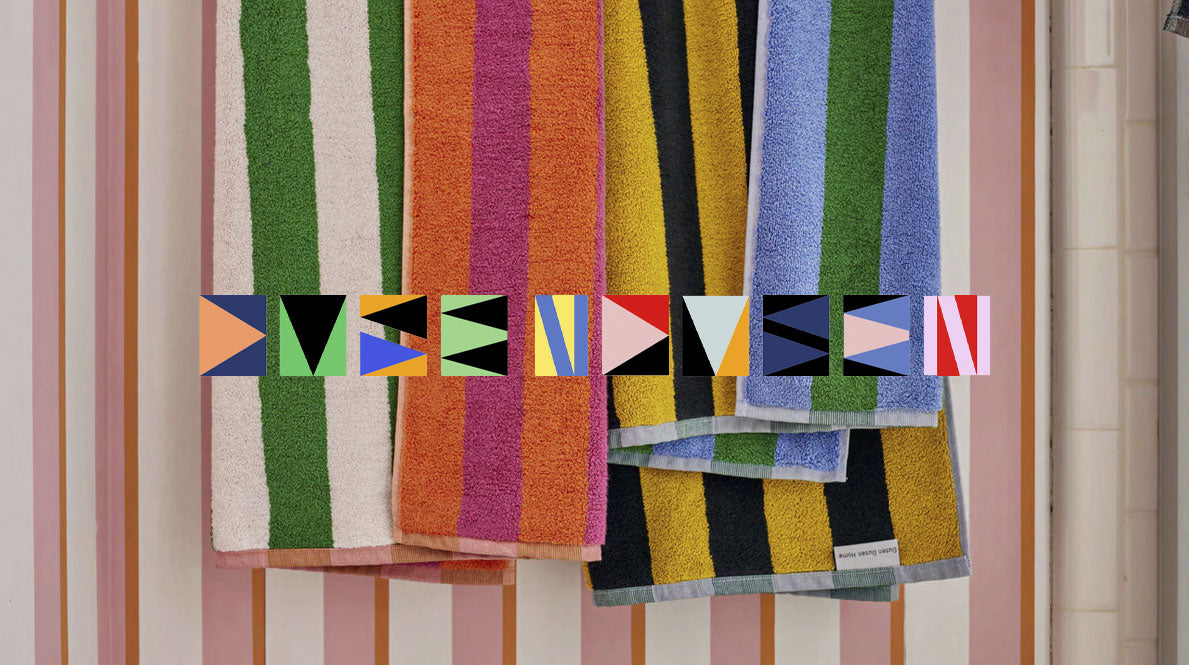 multi-colored striped towels and the Dusen Dusen logo superimposed.