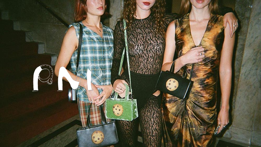 Models backstage at the SS23 Puppets and Puppets show holding their small Cookie Bags.