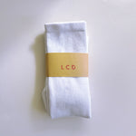 A classic unisex crew sock in white.