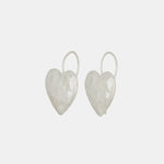 Close side detail photo of the Heart Burn Earrings - White Bronze.