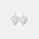 Flat detail photo of the Heart Burn Earrings - White Bronze.