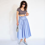 A model wears the super cropped medium grey Joni Tee from Maryam Nassir Zadeh - full outfit view.