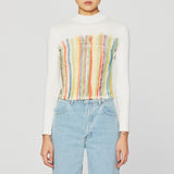 Half body photo of model wearing the Lapped Turtleneck - Stained Glass.