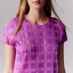 Close detail photo of model wearing the Pace Dress - Pink.