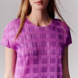 Close detail photo of model wearing the Pace Dress - Pink.
