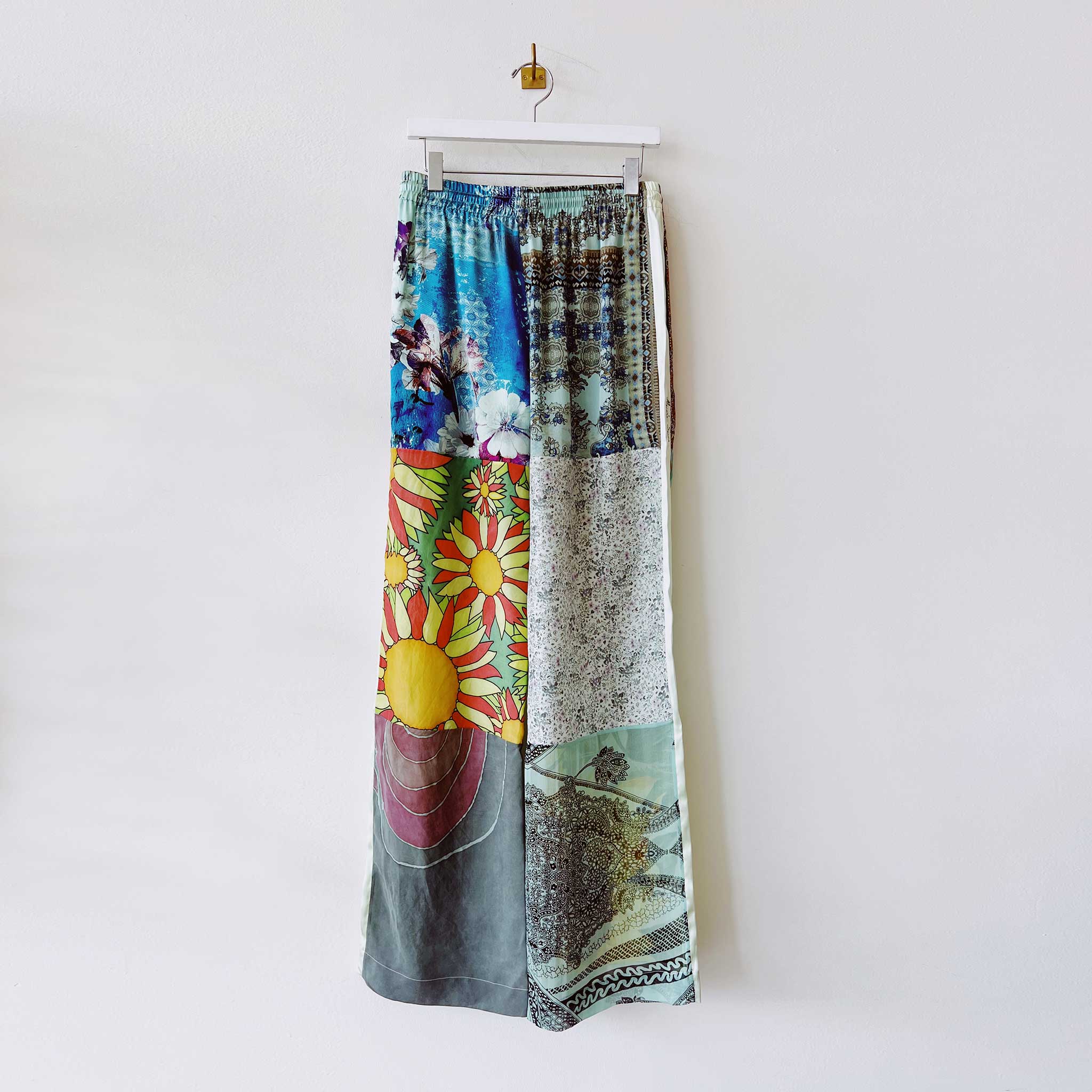 Silk pajama style pants created from multiple vintage scarves and overdyed in a seafoam green tonal color - back of the size Small.