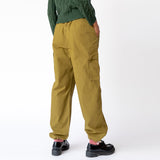 Back view of the olive green Ripstop Cargo Beach Pant by Stussy, paired with black loafers.