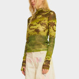 Angled view of the Thumbtastic Top, which features a mock neck and long sleeves with thumb holes.