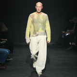 Full body runway photo of model wearing the Composition Sweater - Sand.