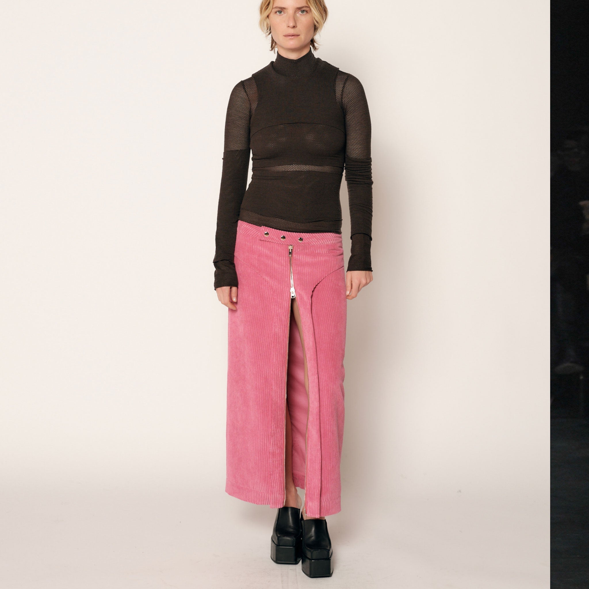 Front full body photo of model wearing the Cord Zip Skirt - Pitaya.