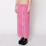 Side half body photo of model wearing the Cord Zip Skirt - Pitaya.