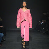 Full body photo runway photo of a model wearing the Cord Zip Skirt - Pitaya