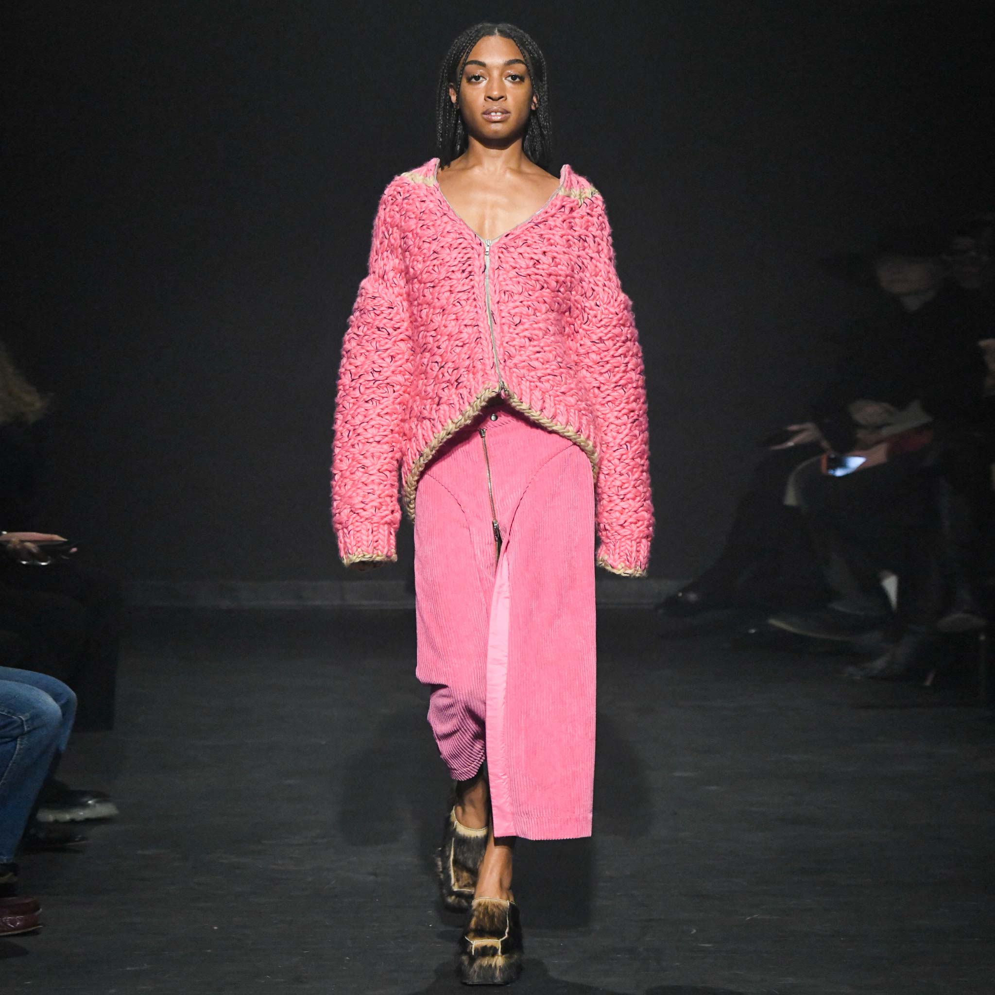 Full body photo runway photo of a model wearing the Cord Zip Skirt - Pitaya