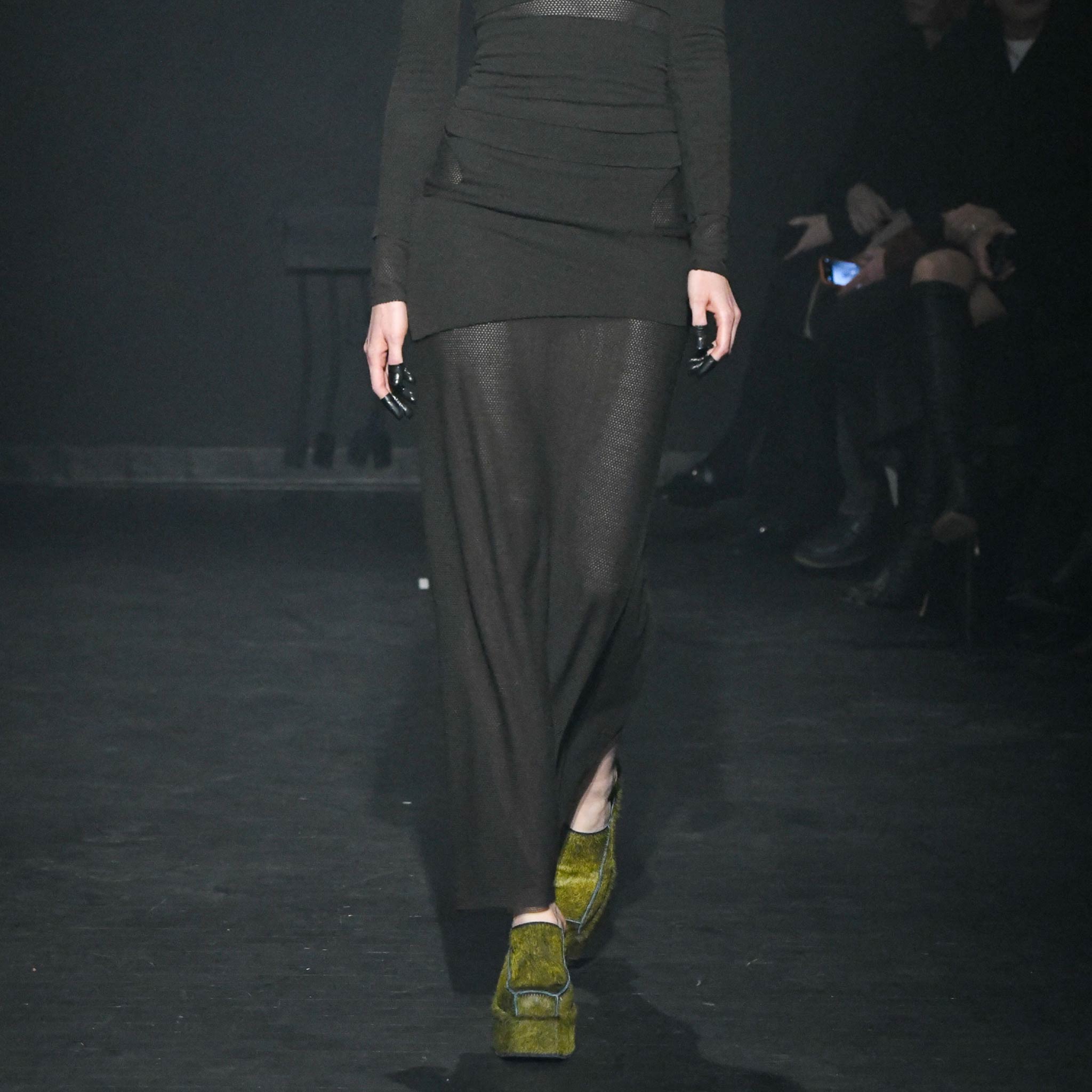 Close half body runway photo of model wearing the Eclipse Skirt - Stone.