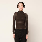 Close half body photo of model wearing the Eclipse Turtleneck - Stone.