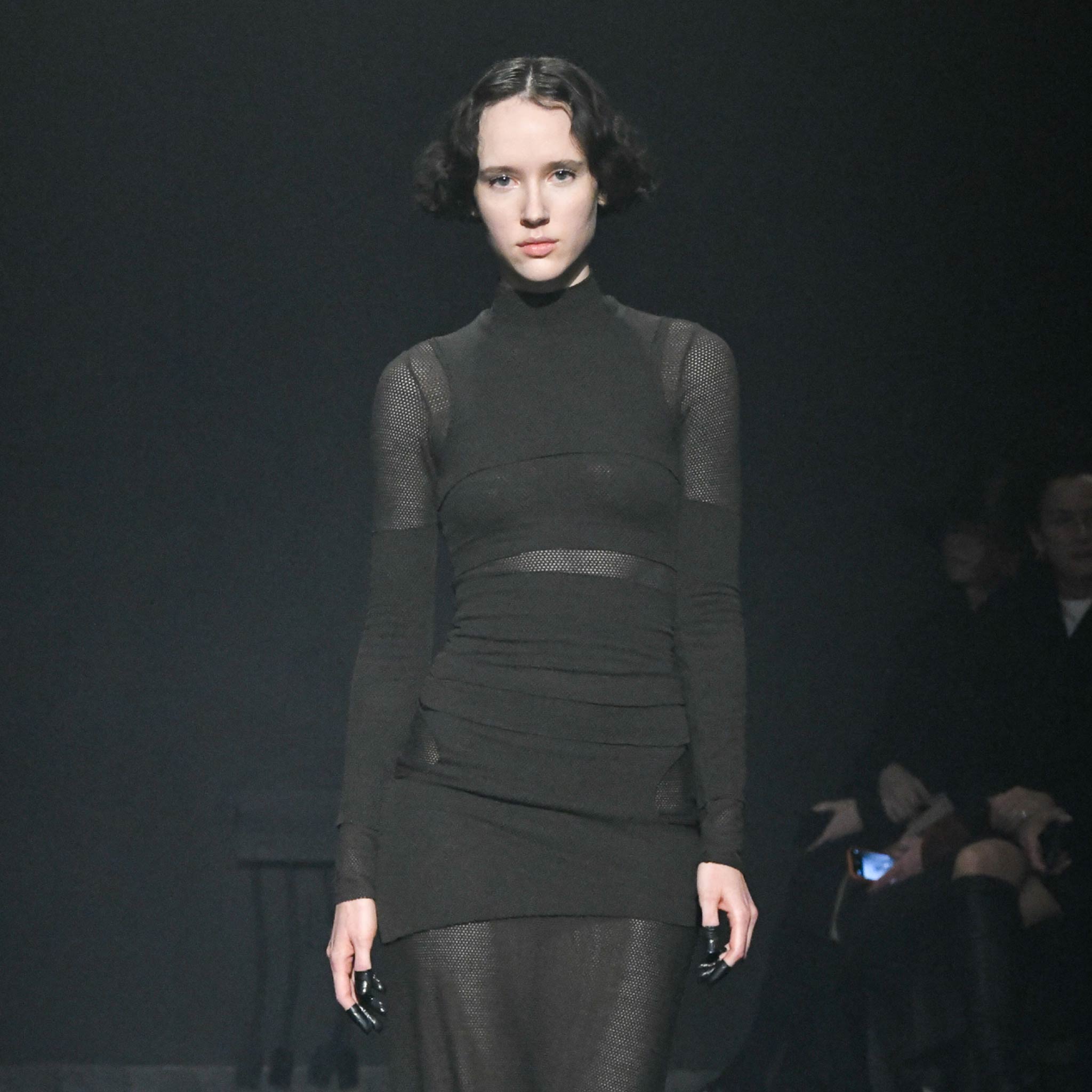 Close half body runway photo of model wearing the Eclipse Turtleneck - Stone.