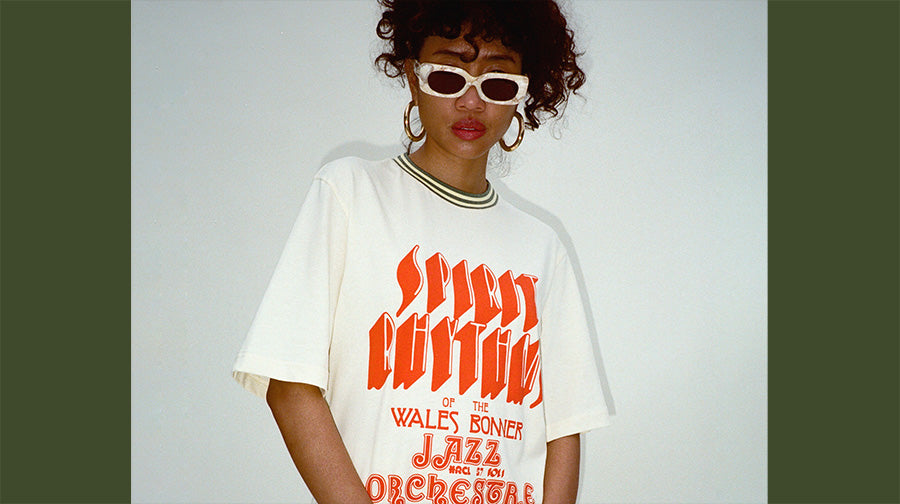 Photo of a model wearing sunglasses and new Wales Bonner SS22 graphic tee.