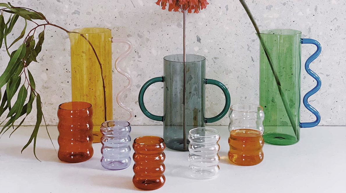 various colorful glassware and vases designed by Sophie Lou Jacobsen.