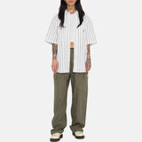 Full body photo of model wearing the Boxy Striped SS Shirt - Off White Stripe.