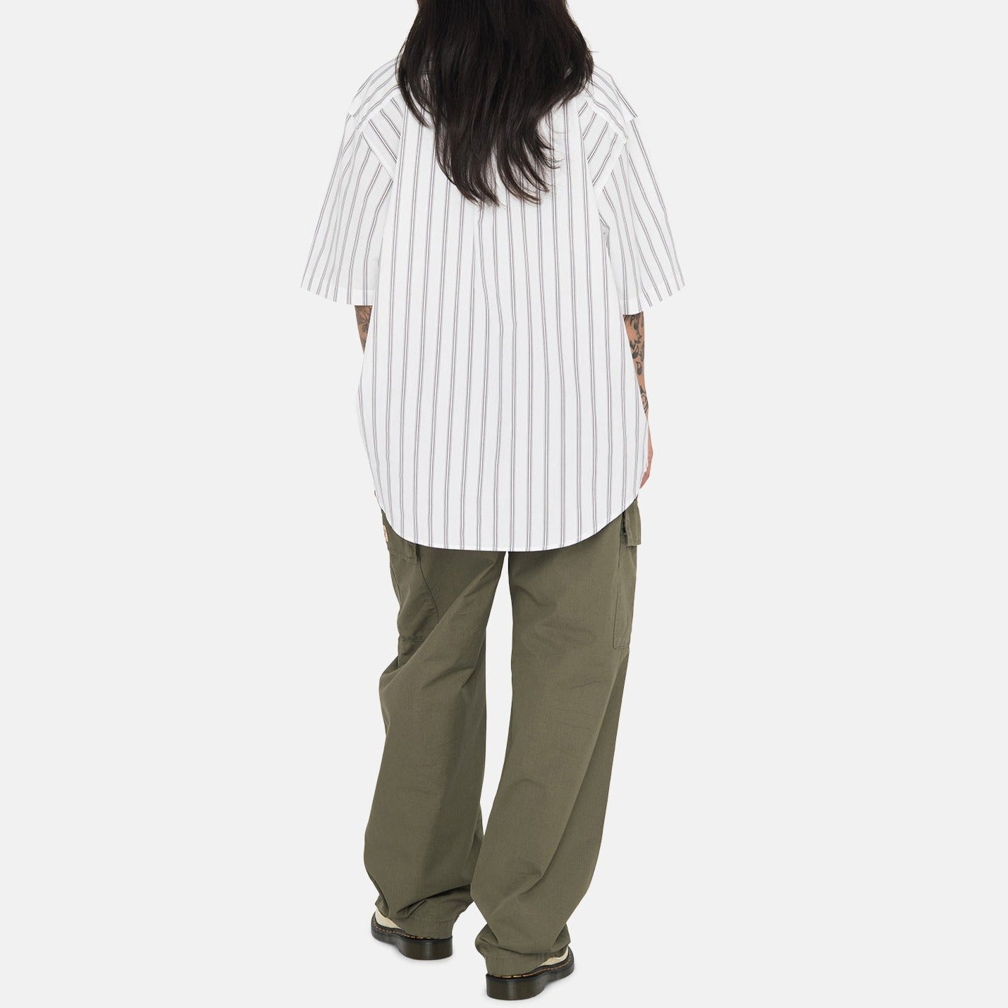 Back full body photo of model wearing the Boxy Striped SS Shirt - Off White Stripe.