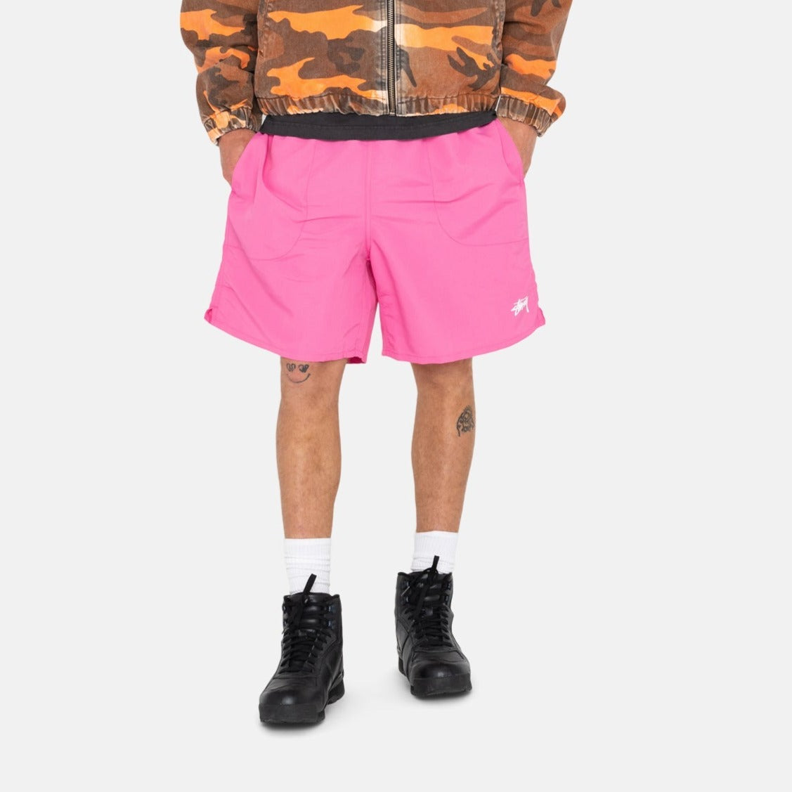 Half body photo of model wearing the Stock Water Short - Gum Pink.