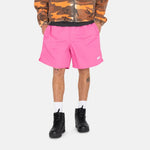Half body photo of model wearing the Stock Water Short - Gum Pink.