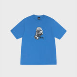 Front flat photo of the stussy All Bets Off Pigment Dyed Tee - Blue. The shirt features a black and white grpahic of a hand holding a deck of cards with the black stussy logo on it.