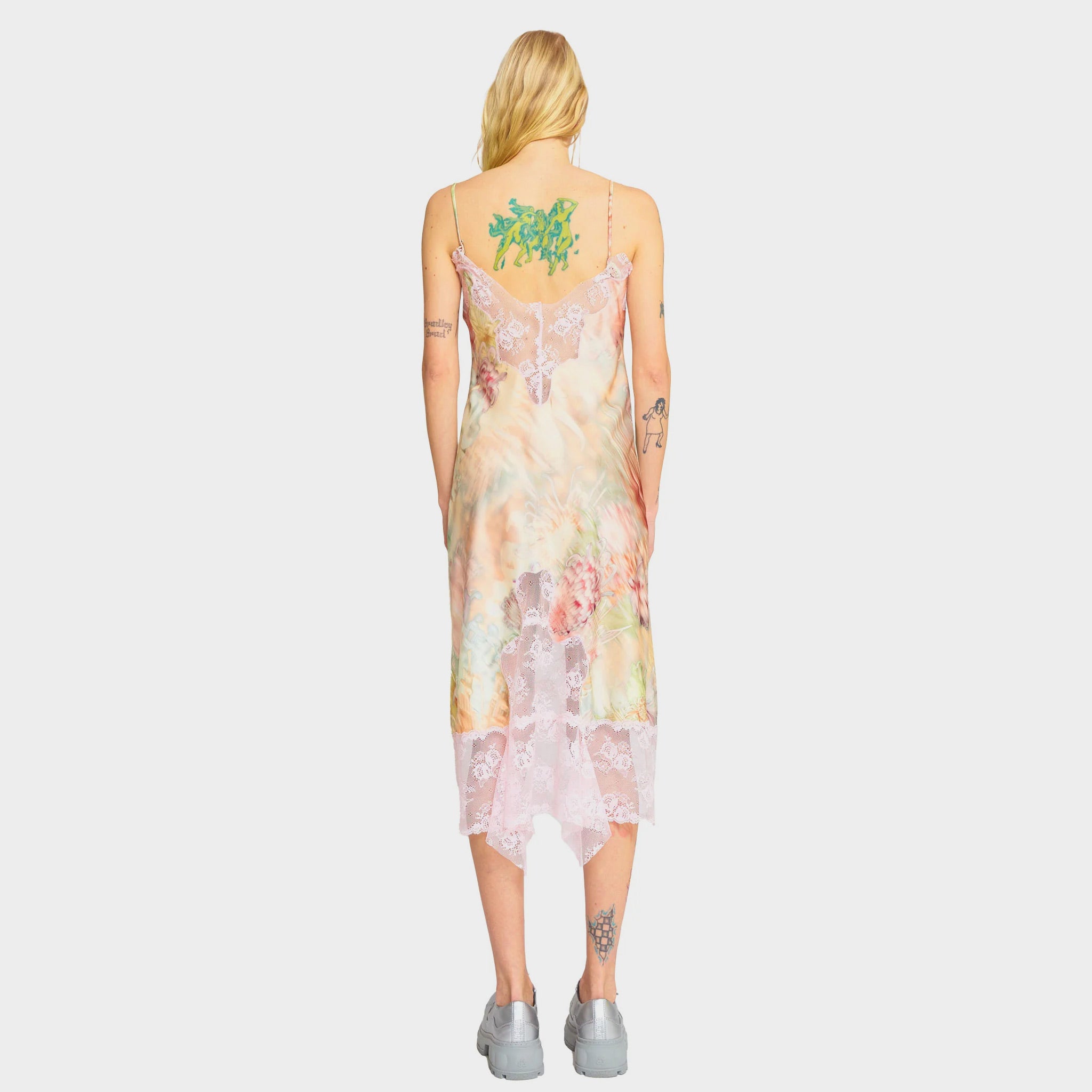 Back half body photo of model wearing the Ammi Dress - Light Chrysanthemum.