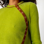 Close up detail of the ribbed lime green Angle Cardigan by Eckhaus Latta featuring buttons that flow in a curved line along the left side of the chest.