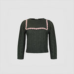 Flat photo of the Auto Sweater. The sweater features a large collar with a pink lace trim.