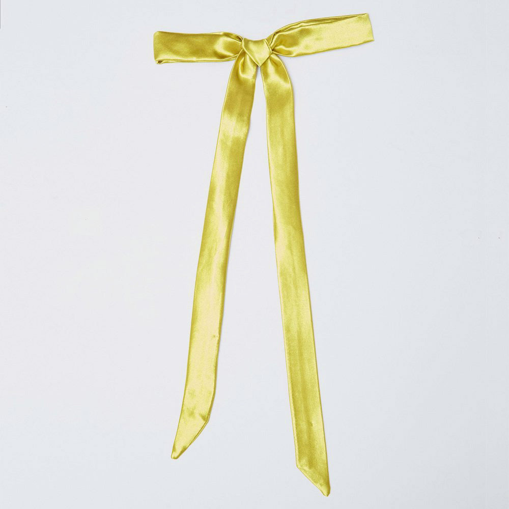 Flat photo of the Hair Bow, a long satiny hair ribbon in a light green artichoke color.