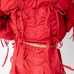 Close detial photo of model wearing the Cam Pants.
