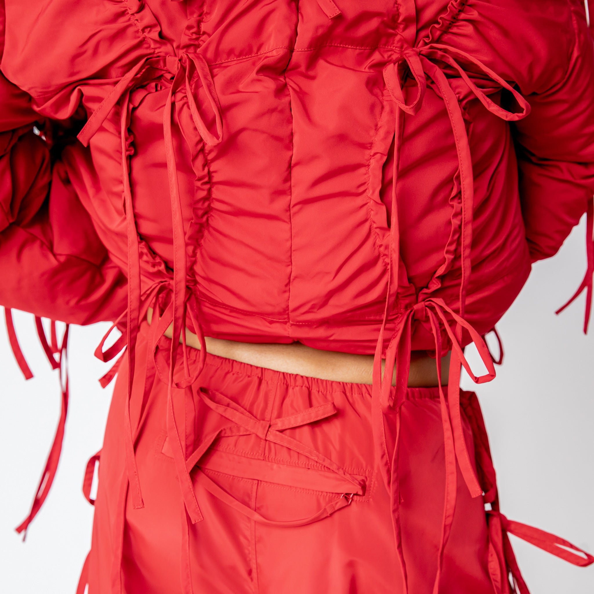 Close detial photo of model wearing the Cam Pants.