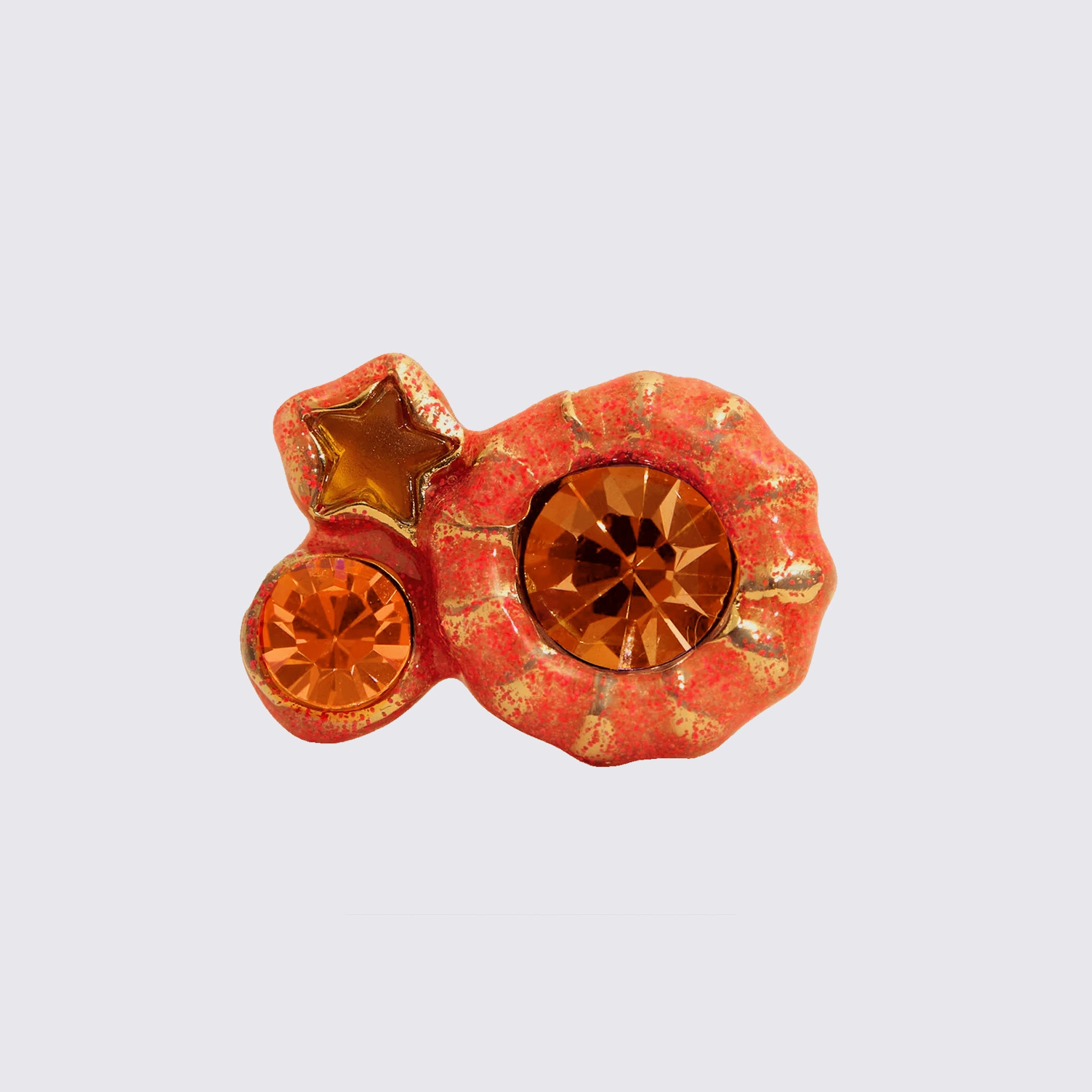 A vivid orange ring with gold specks in an organic triple pod shape with orange glass gems.