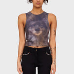 A model wears a fitted tank top printed with the face of a cute black dog.