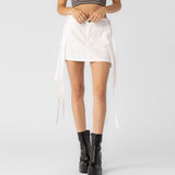 Close half body photo of model wearing the Cargo Strap Mini Skirt - White.