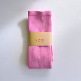 A classic unisex crew sock in hot pink.