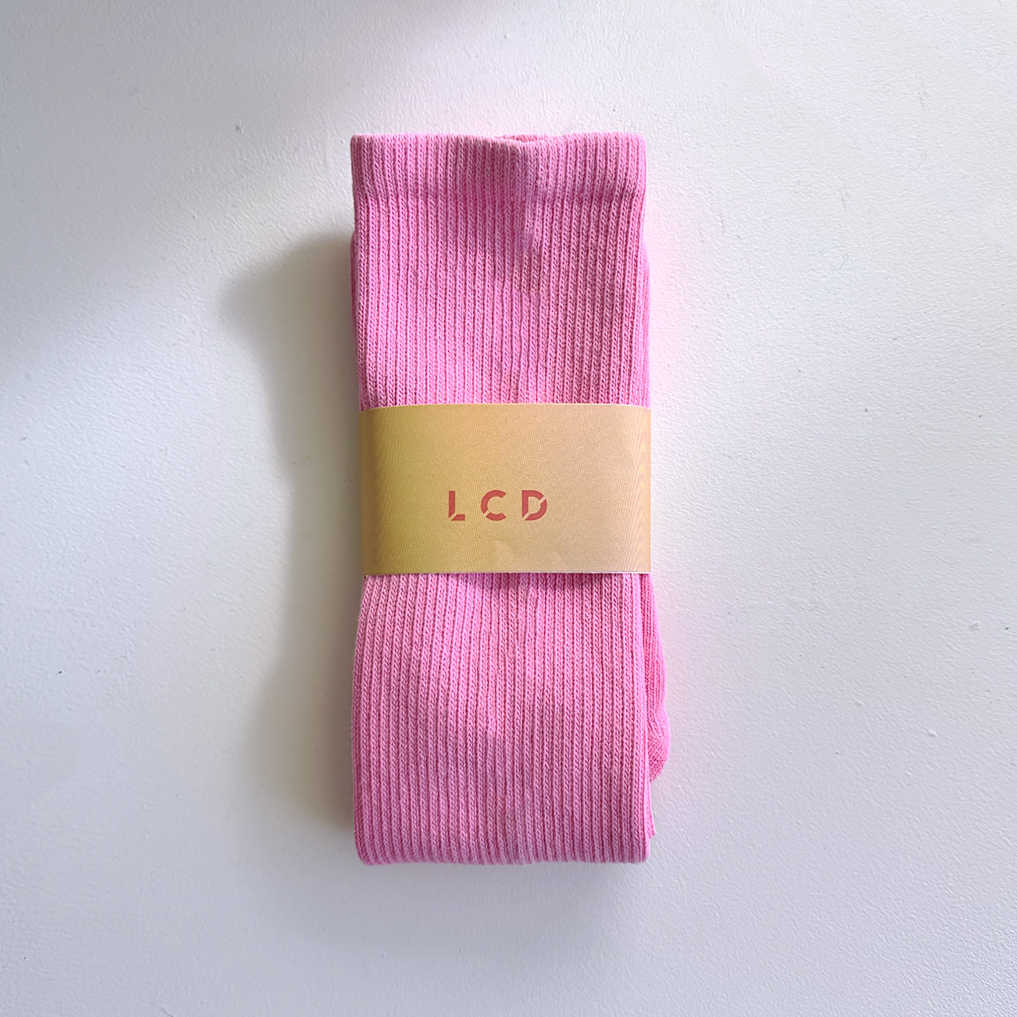 A classic unisex crew sock in hot pink.