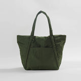 Baggu's puffy Cloud nylon bag in a trapezoidal shape and dark green colorway.