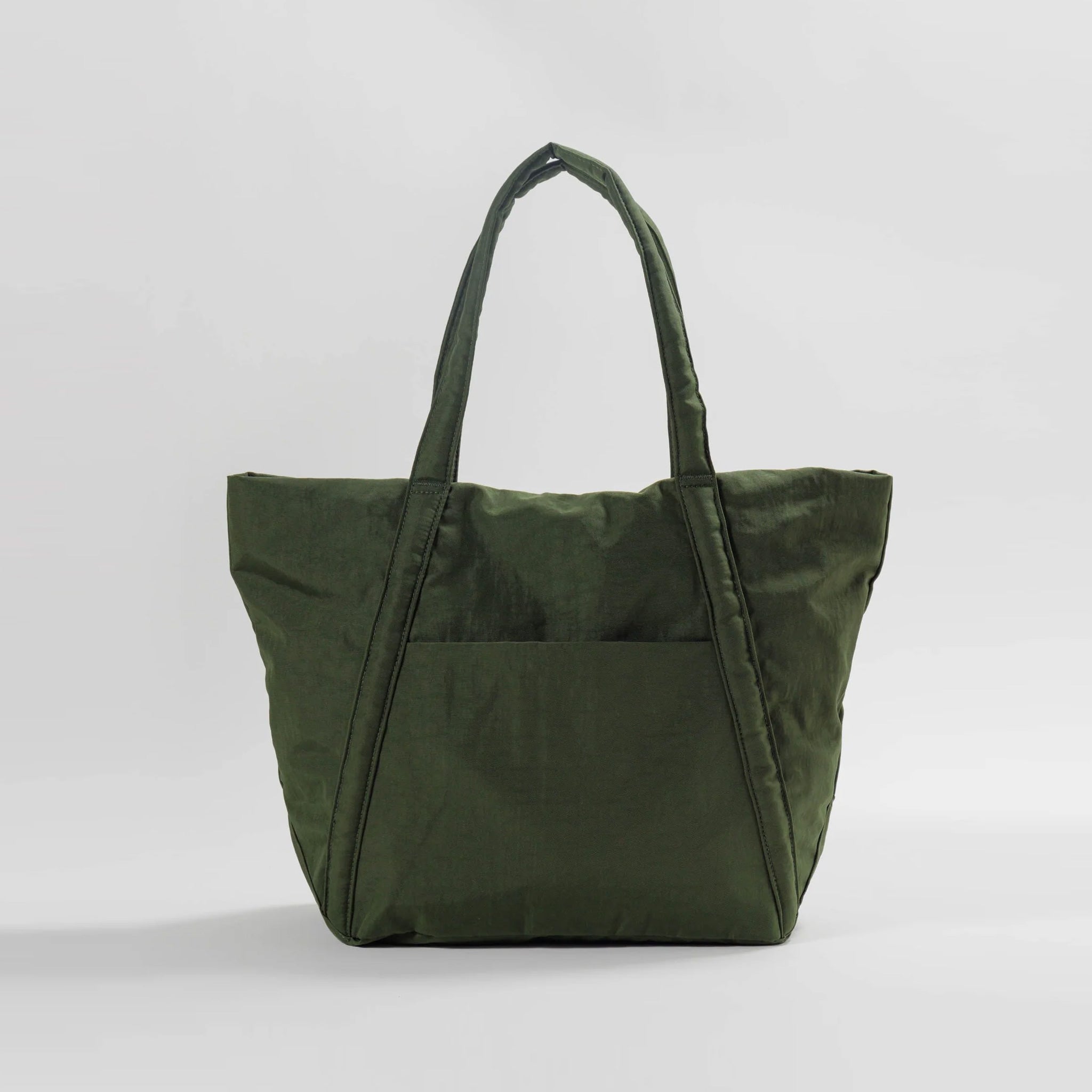 Baggu's puffy Cloud nylon bag in a trapezoidal shape and dark green colorway.