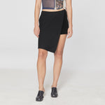 Front half body photo of model wearing the Club Skort - Cynar.