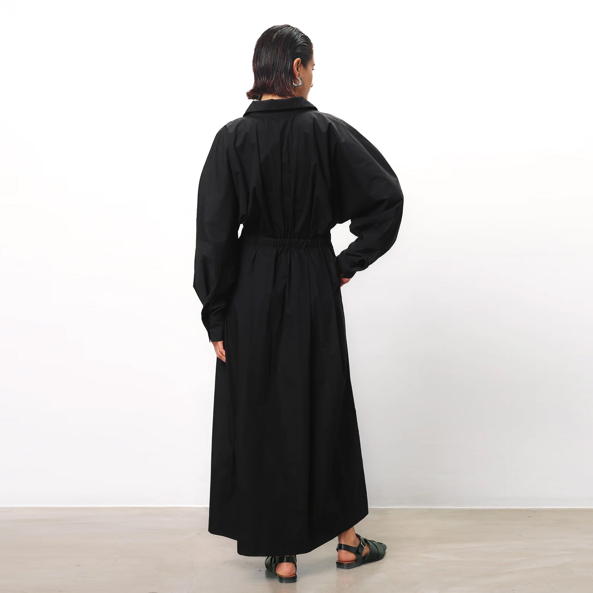 Back full body photo of model wearing the Colleen Dress - Black.