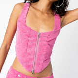 Detailed front photo of the pink corduroy Cord Bustier by Eckhaus Latta, showing the metal front zipper.