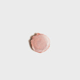 Flat photo of a swatch fromCream Highlight Stick - Perla.