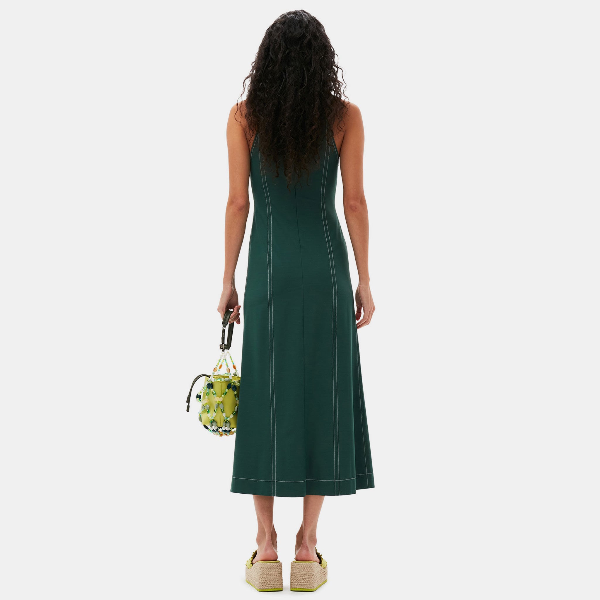 Back full body photo of model wearing the Drapey Maxi Dress - Trekking Green.