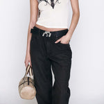 Close detail photo of model wearing the Echo Jean - Black.