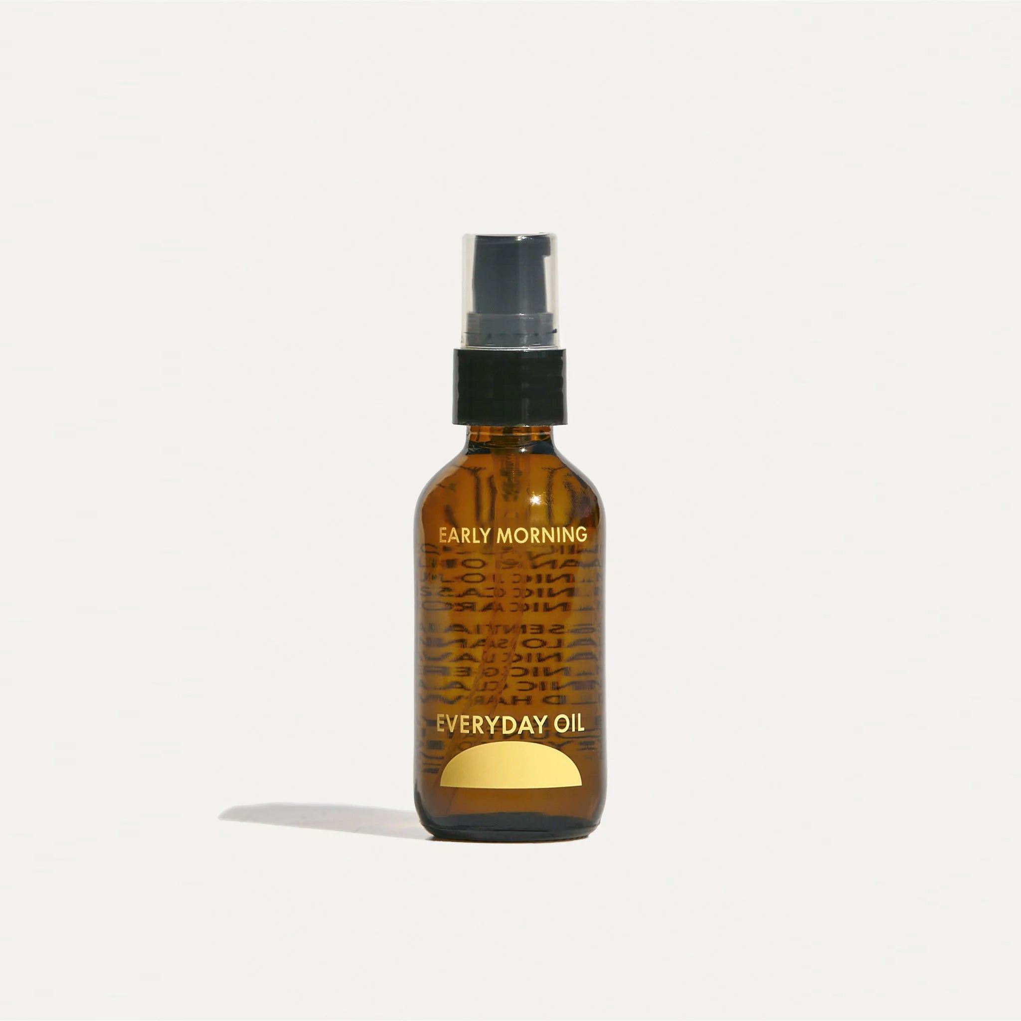 A small amber glass bottle labeled EARLY MORNING by Everyday Oil.