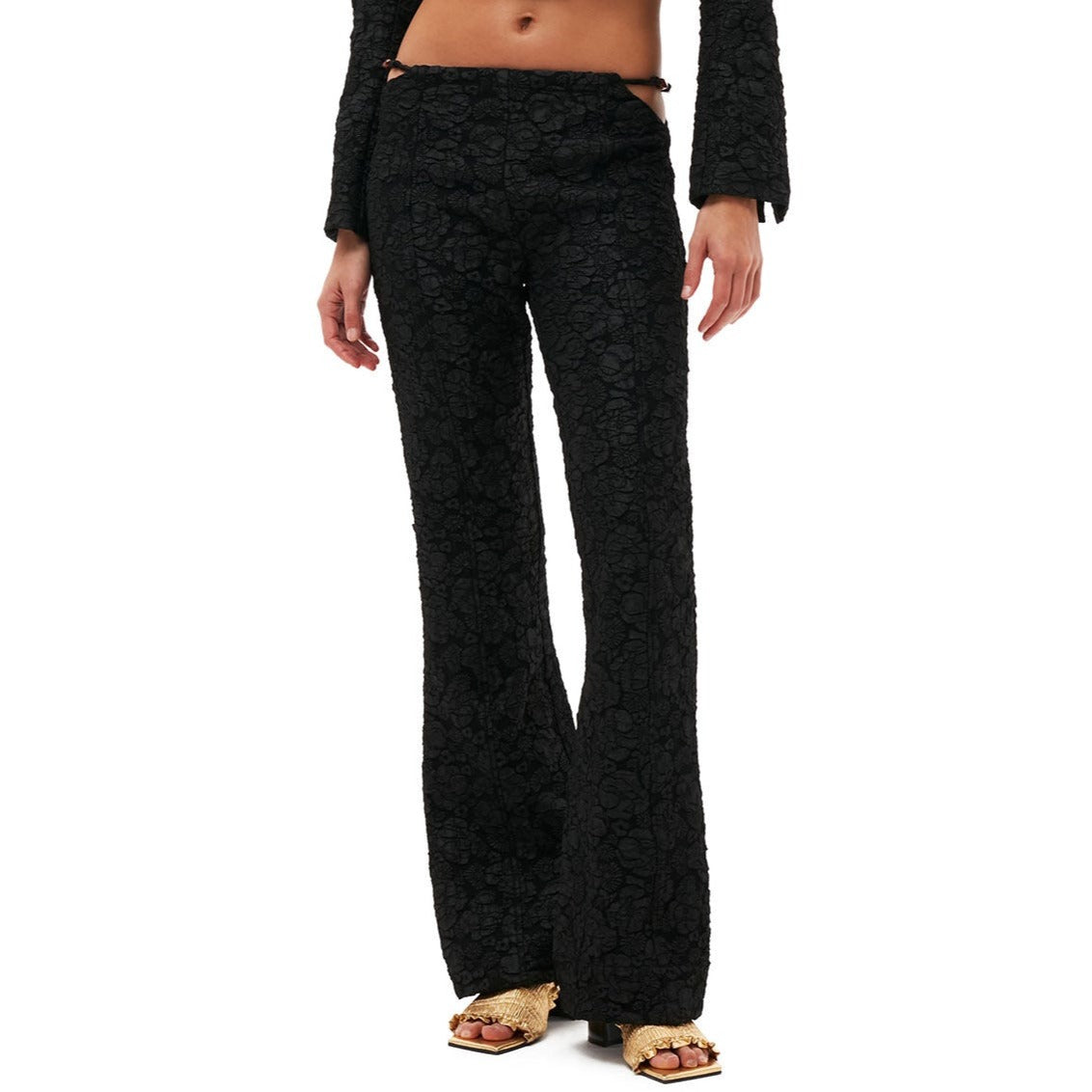 Close half body photo of of model wearing the Stretch Jacquard Flared Pants - Black