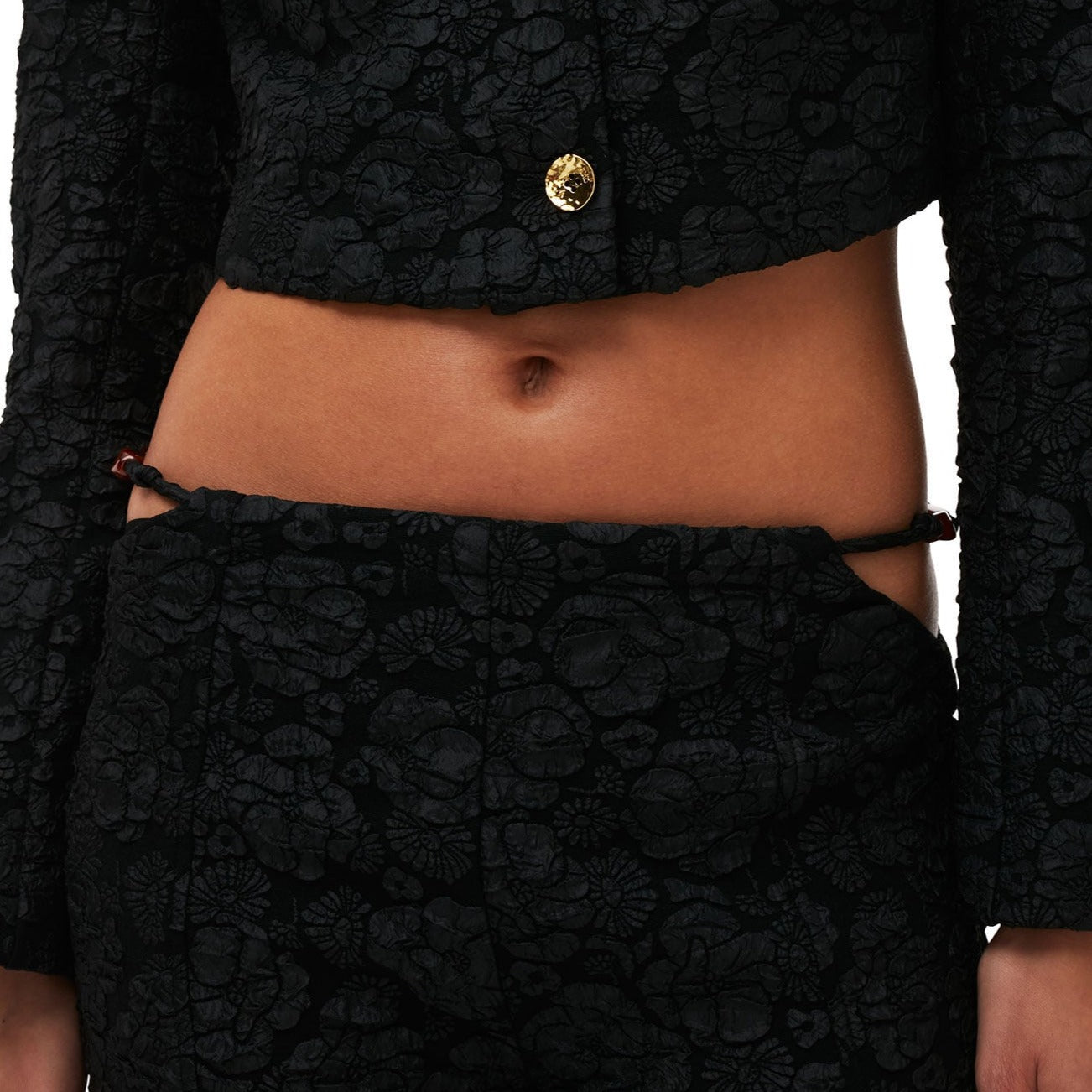 Close detail photo of model wearing the Stretch Jacquard Flared Pants - Black.