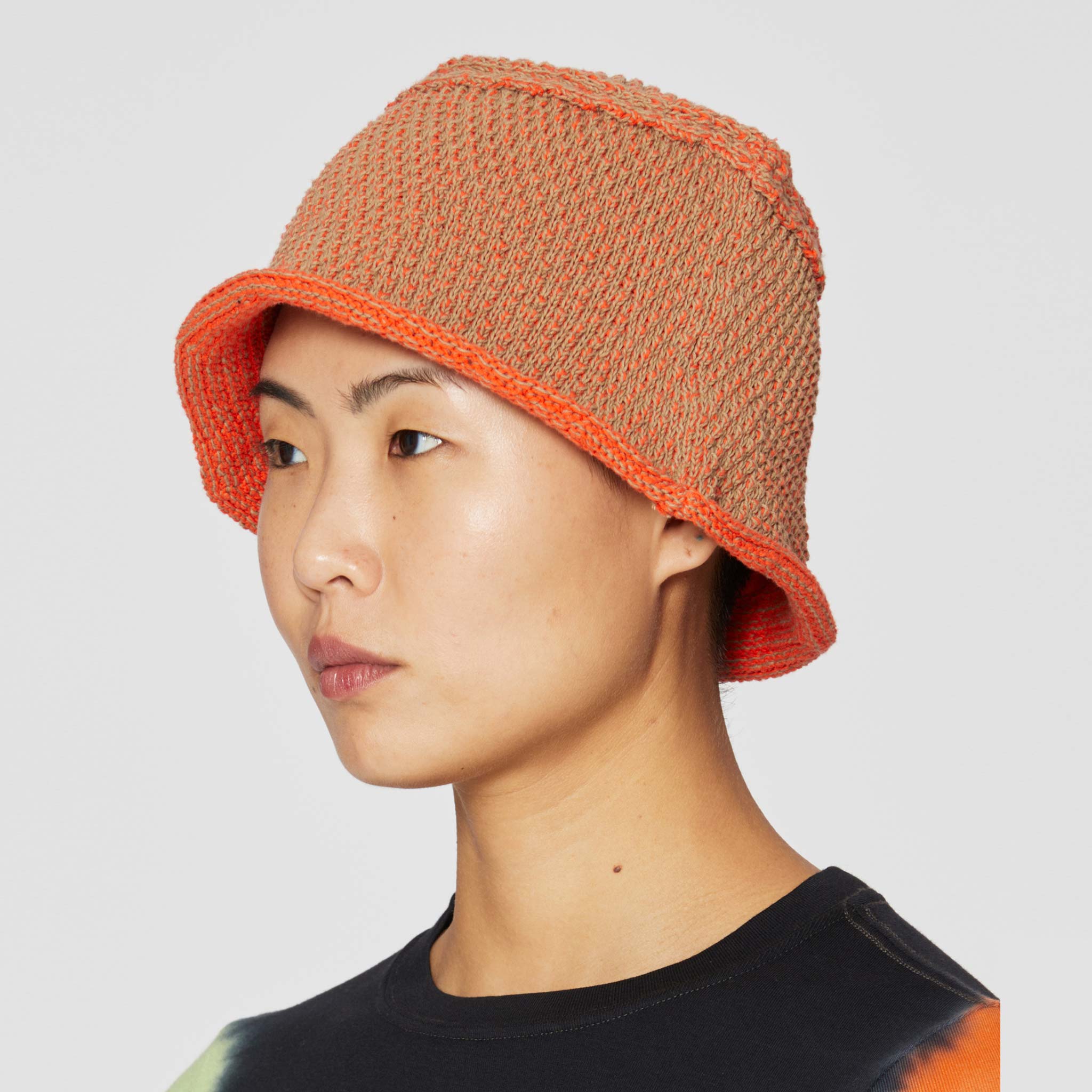 Close detail photo of model wearing the Field Hat - Persimmon.